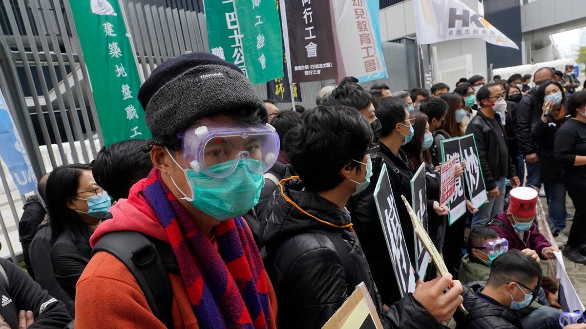 Medical staff strike over coronavirus concerns outside government headquarters in Hong Kong on Wednesday.(AP Photo/Vincent Yu)