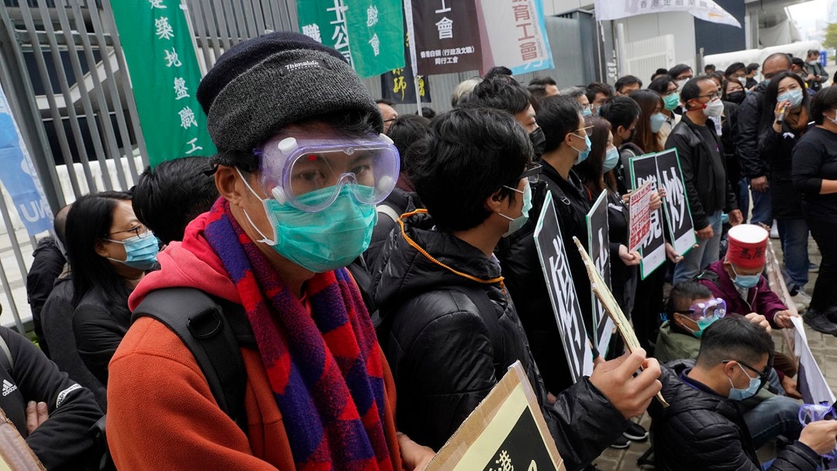 Medical staff strike over coronavirus concerns outside government headquarters in Hong Kong on Wednesday.(AP Photo/Vincent Yu)