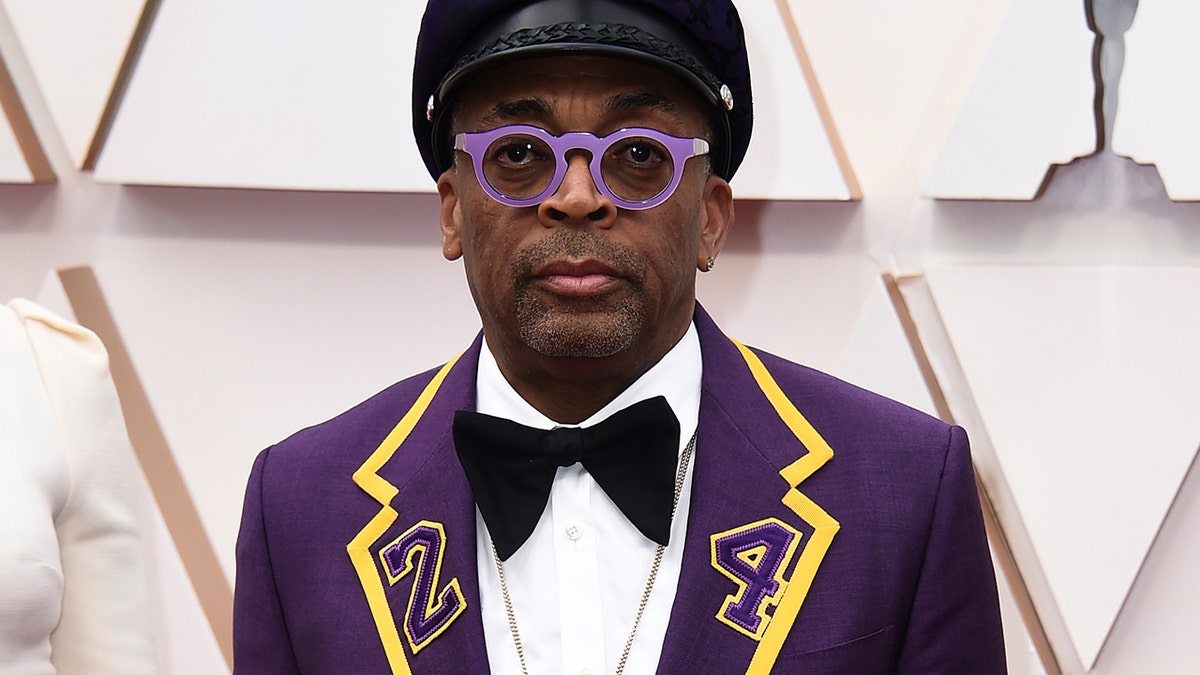 Spike Lee arrives at the Oscars on Sunday, Feb. 9, in a purple and yellow suit in honor of Kobe Bryant.