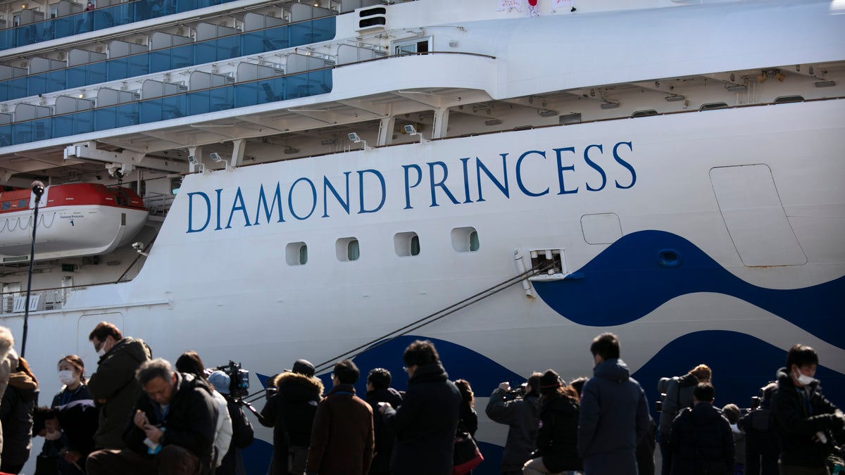 FILE - In this Feb. 11, 2020, file photo, media gather outside the quarantined Diamond Princess cruise ship in Yokohama, near Tokyo.  (AP Photo/Jae C. Hong, File)