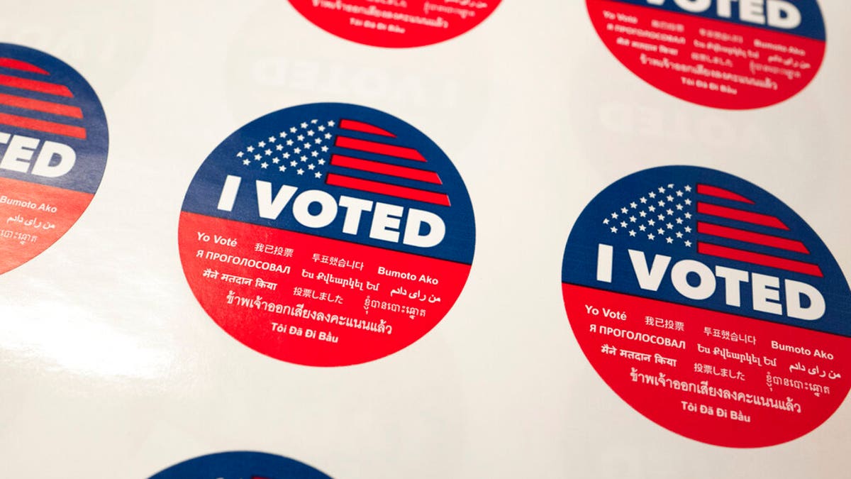 "I Voted" stickers wait for voters at a polling station inside the library at Robert F. Kennedy Elementary School in Los Angeles. California, June 5, 2018. (AP Photo/Richard Vogel, File)