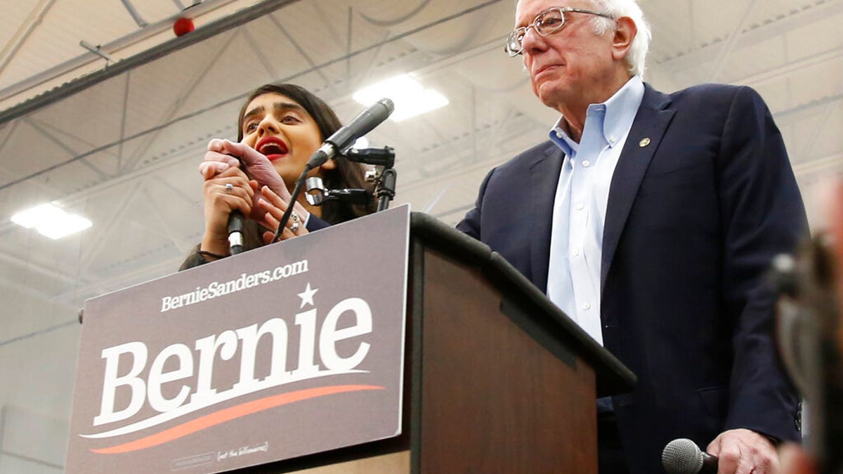 Democratic presidential candidate Sen. Bernie Sanders I-Vt., has his remarks interrupted by a protestor, left, during his campaign event in Carson City, Nev.., Sunday, Feb. 16, 2020. (AP Photo/Rich Pedroncelli)