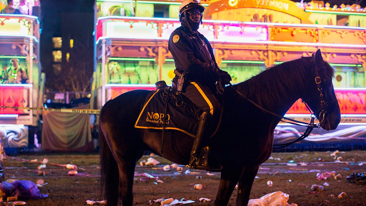 A police officer works the scene where a man was reportedly hit and killed by a float of the Krewe of Endymion parade in the runup to Mardi Gras in New Orleans, Saturday, Feb. 22, 2020. (Associated Press)