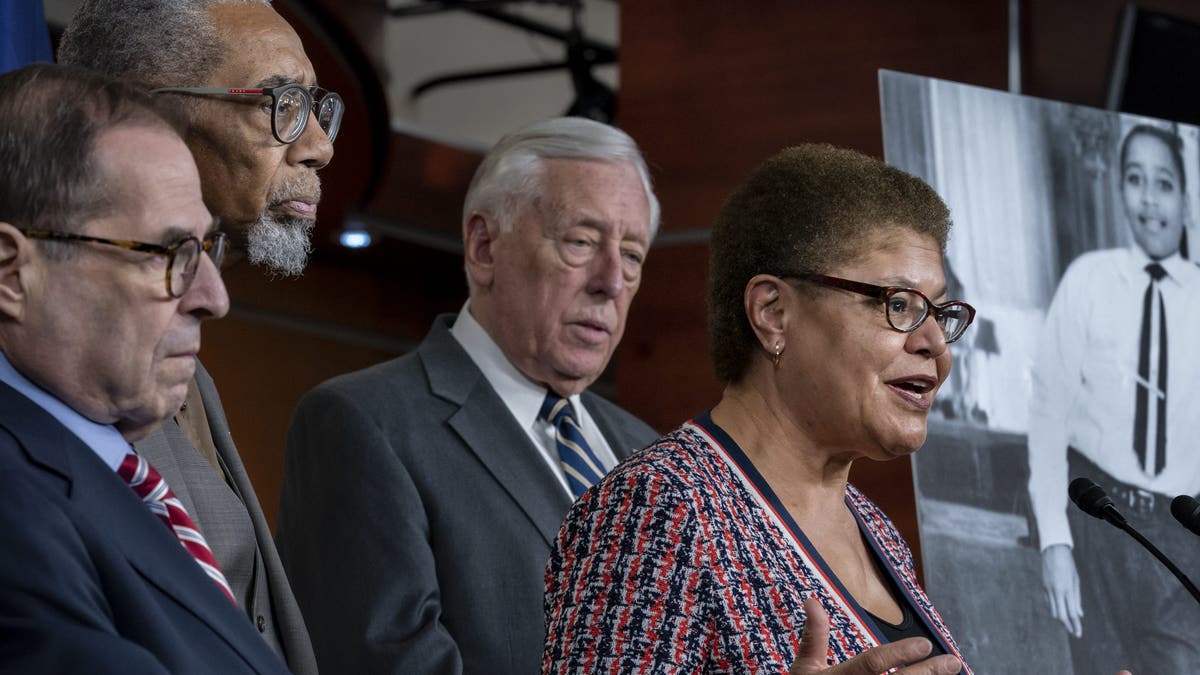 From left, House Judiciary Committee Chairman Jerrold Nadler, D-N.Y., Rep. Bobby Rush, D-Ill., House Majority Leader Steny Hoyer, D-Md., and Rep. Karen Bass, D-Calif., chair of the Congressional Black Caucus, hold a news conference to discuss the "Emmett Till Antilynching Act" which would designate lynching as a hate crime under federal law, on Capitol Hill in Washington, Wednesday, Feb. 26, 2020. Emmett Till, pictured at right, was a 14-year-old African-American who was lynched in Mississippi in 1955, after being accused of offending a white woman in her family's grocery store. (AP Photo/J. Scott Applewhite)