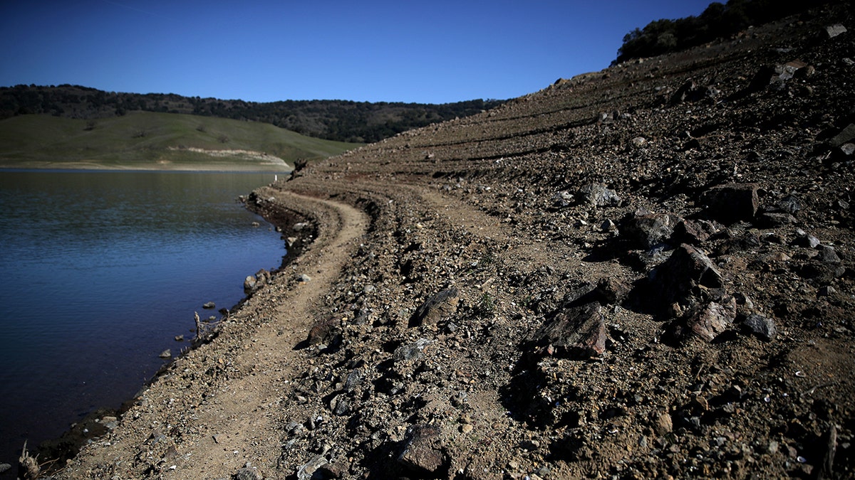 Water lines are visible along the banks of the Anderson Reservoir on February 25, 2020 in Morgan Hill, California.