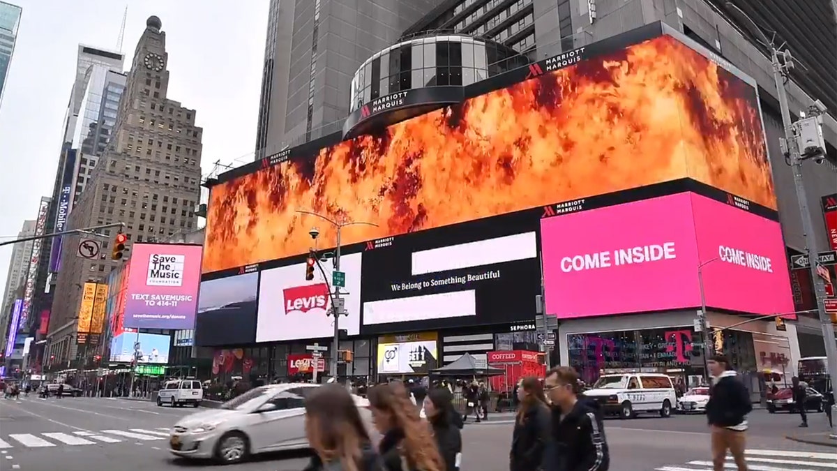 The message displayed in Times Square read "Imagine fighting a bush fire higher than this billboard" before being engulfed in flames.