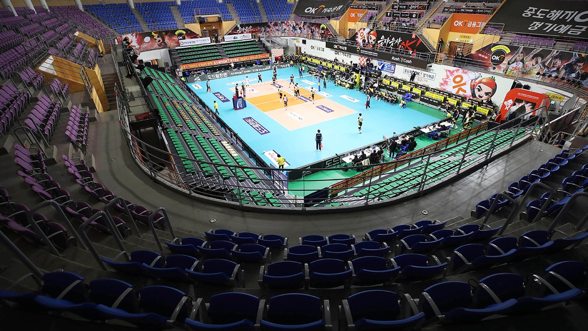 Stadium seats are empty during the pro volleyball V-league between OK Savingbank Rush&amp;Cash and KB Insurance Stars in Ansan, South Korea, Wednesday, Feb. 26, 2020. The volleyball game held without spectators as a precaution against the COVID-19. (Hong Ki-won/Yonhap via AP)