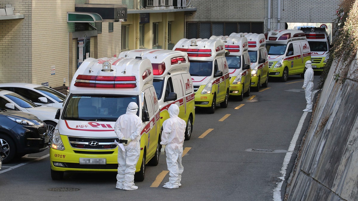 Ambulances carrying patients infected with the novel coronavirus arrive at a hospital in Daegu, South Korea, Sunday, Feb. 23, 2020.