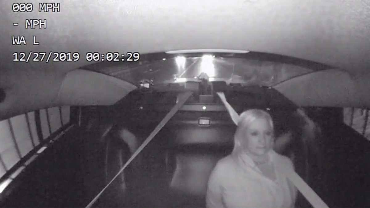 Image from a video showing Michigan state Rep. Rebekah Warren in the backseat of a patrol car after a drunk driving arrest on Dec. 26