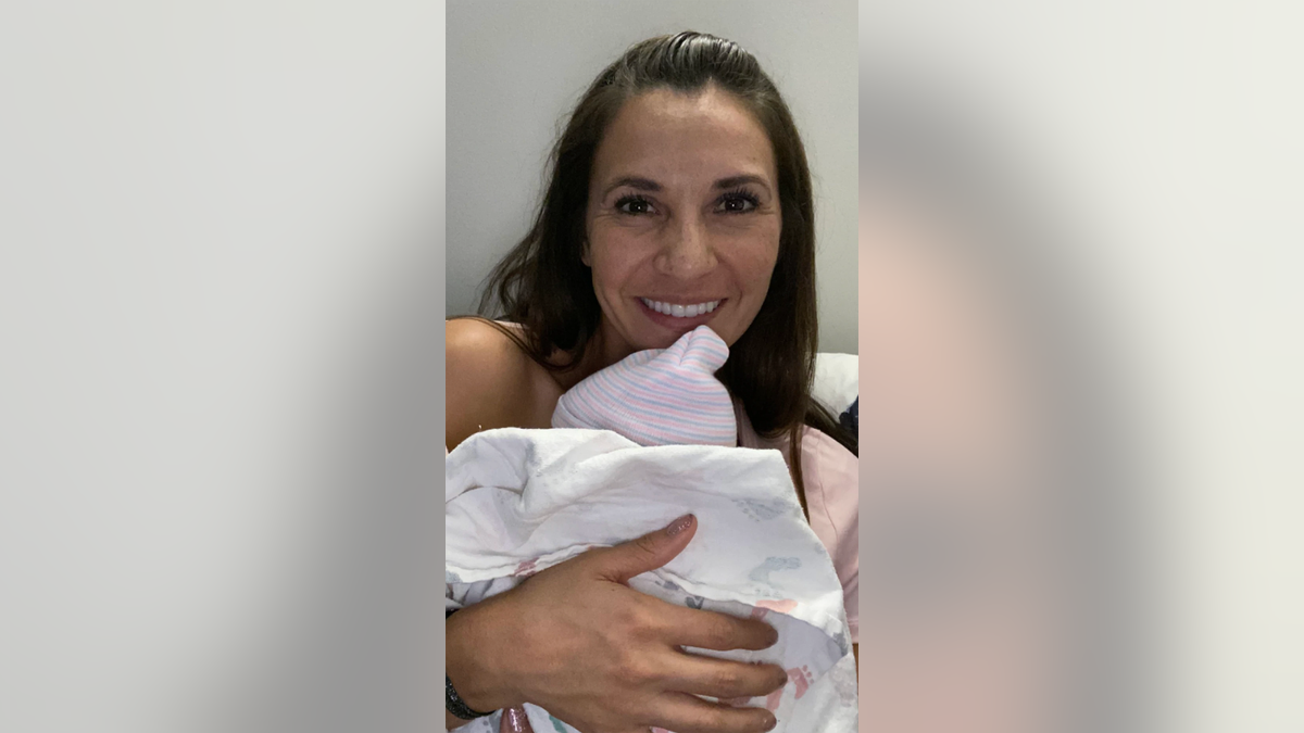 Caren Moore and their new baby, pictured.