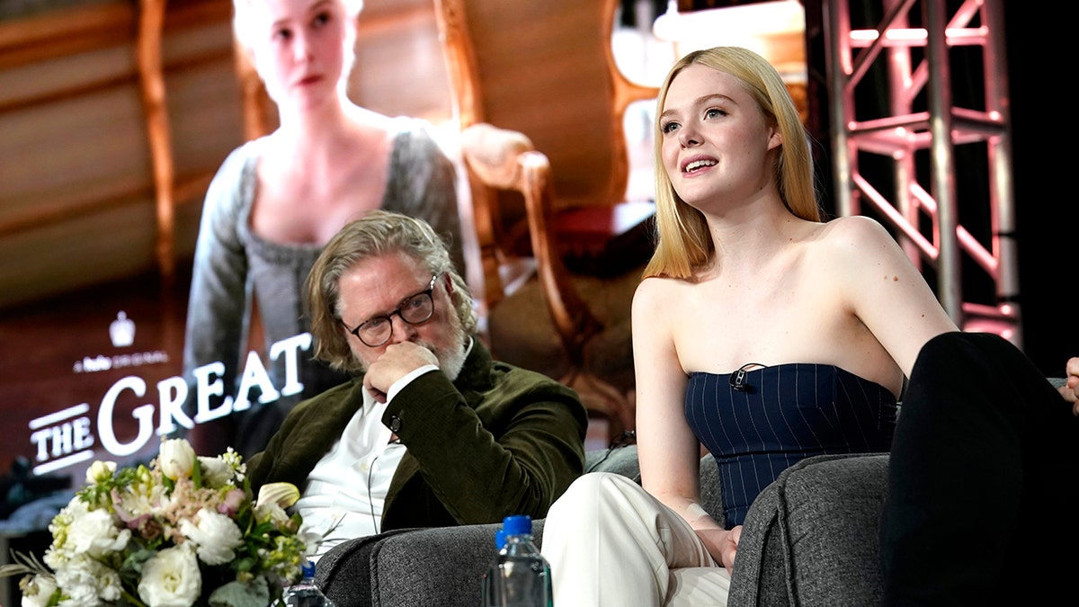 Tony McNamara, left, and Elle Fanning speak onstage during the Hulu Panel at Winter TCA 2020 at The Langham Huntington, Pasadena on January 17, 2020 in Pasadena, Calif. (Photo by Erik Voake/Getty Images for Hulu)