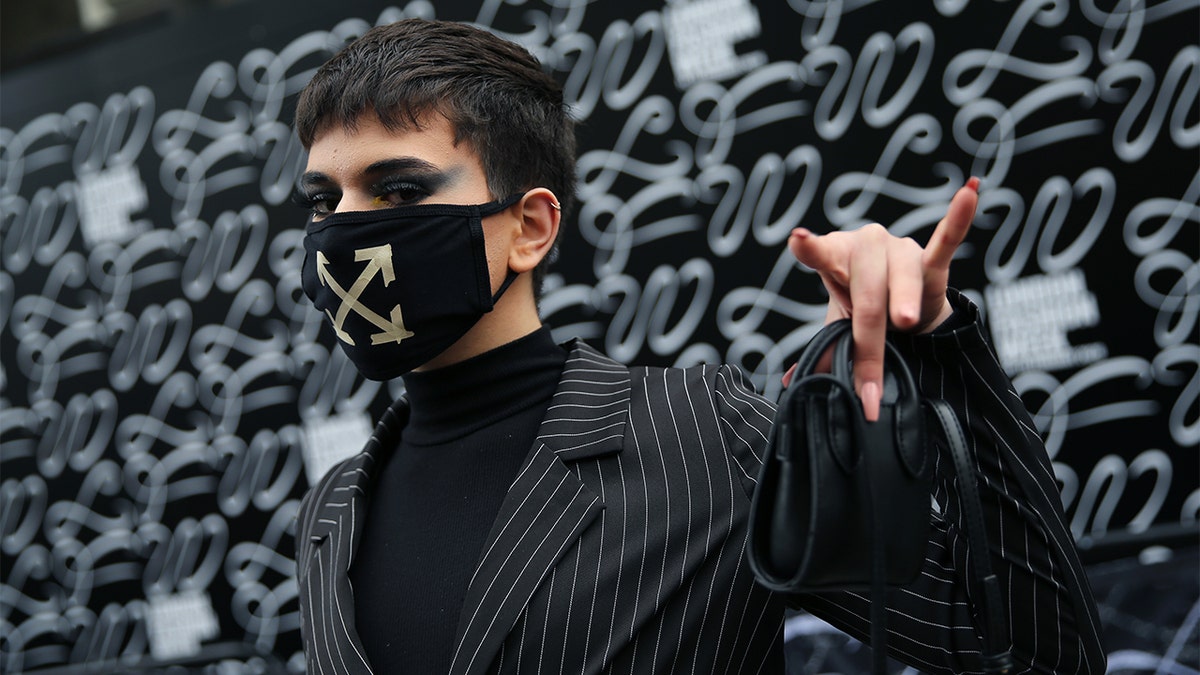A model wears a face mask by On/Off designer during London Fashion Week February 2020 outside the BFC Show Space Show in London. (Photo by Isabel Infantes/PA Images via Getty Images)