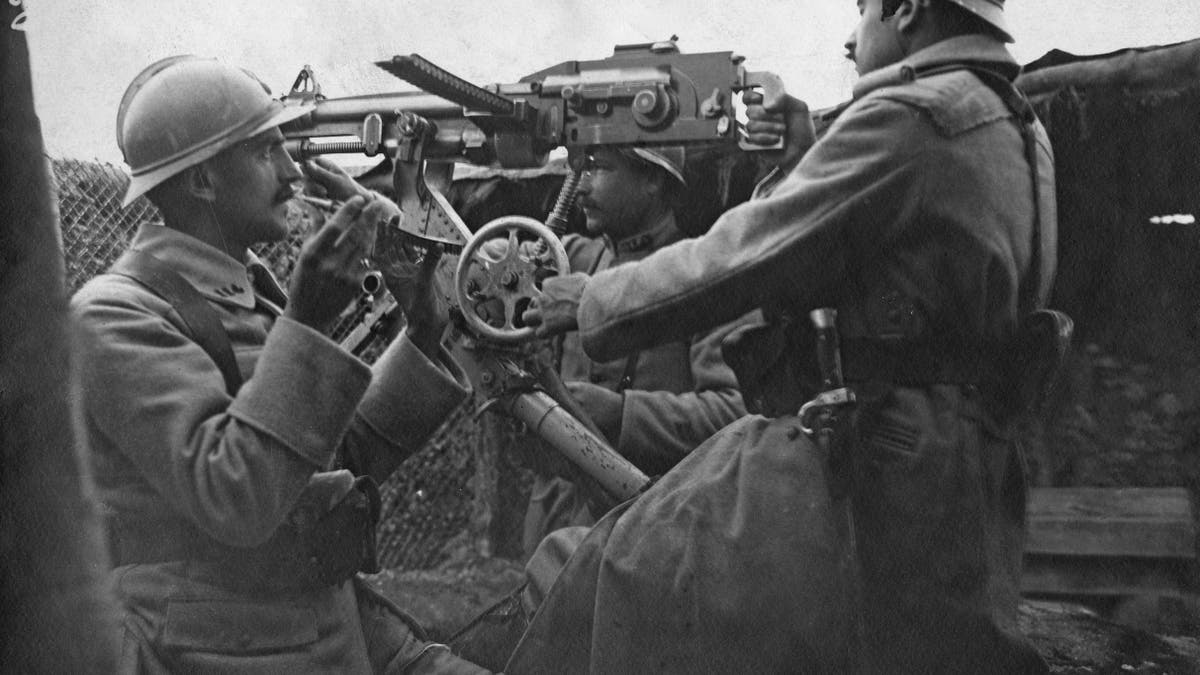 French soldiers manning a machine gun in Marne, during World War I, circa 1915. They are wearing the distinctive Adrian helmet.
