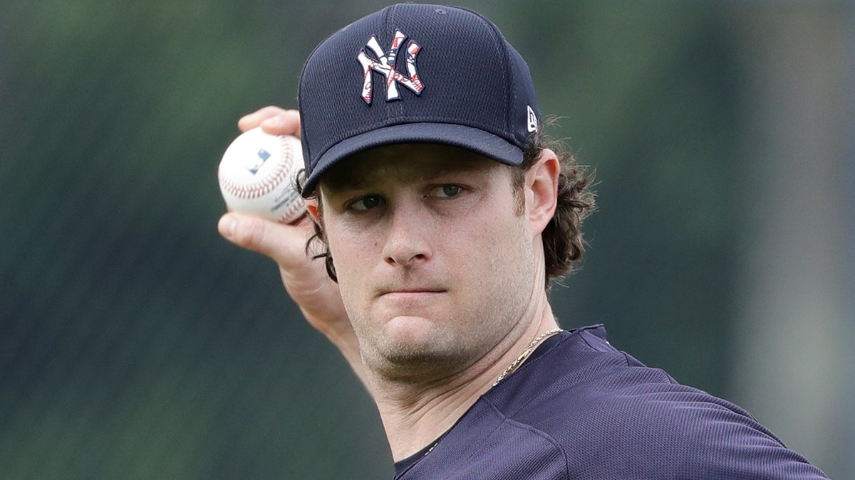 New York Yankees' Gerrit Cole throws to first base during a spring training baseball workout Thursday, Feb. 13, 2020, in Tampa, Fla. (AP Photo/Frank Franklin II)