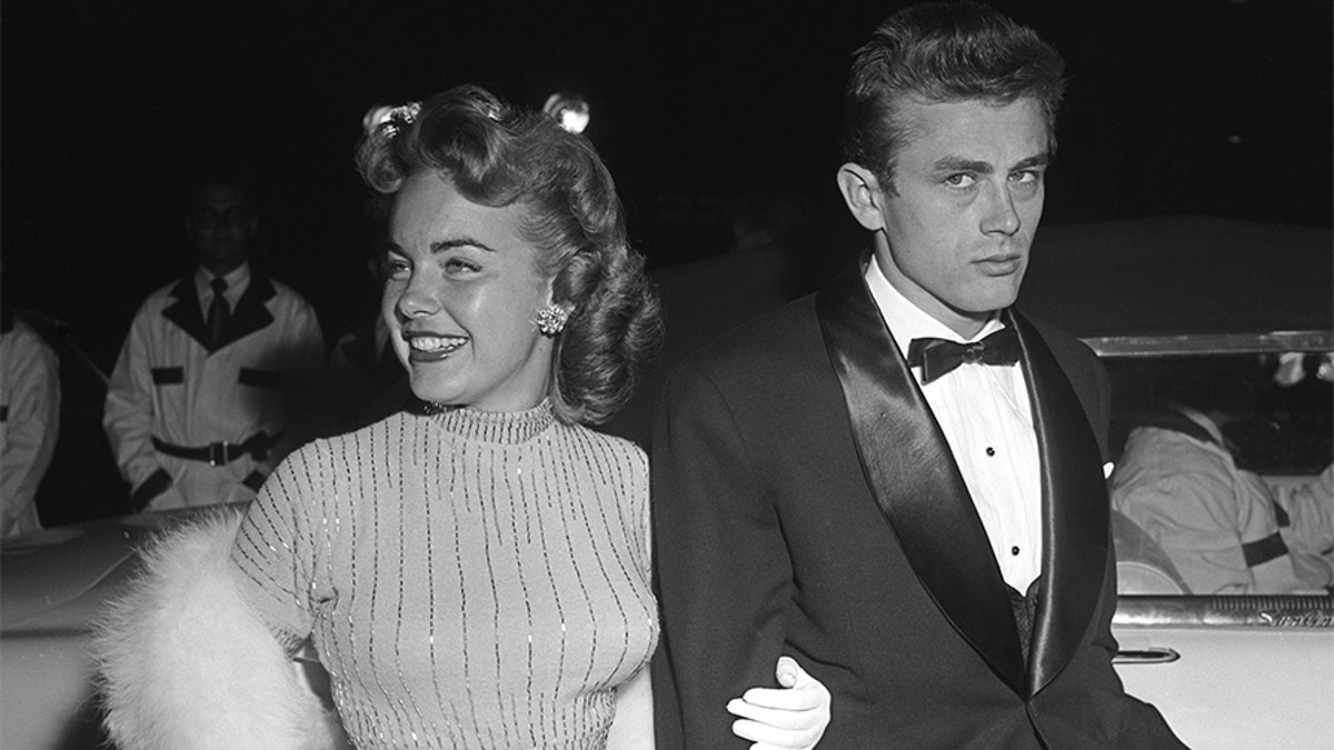 Movie star James Dean and actress Terry Moore attend the Premiere of 'Sabrina' on September 22, 1954, in Los Angeles, California.