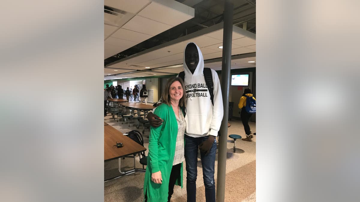 Storm Lake Schools Superintendent Stacey Cole, seen with a high school student, says the kids in her district have welcomed each other.