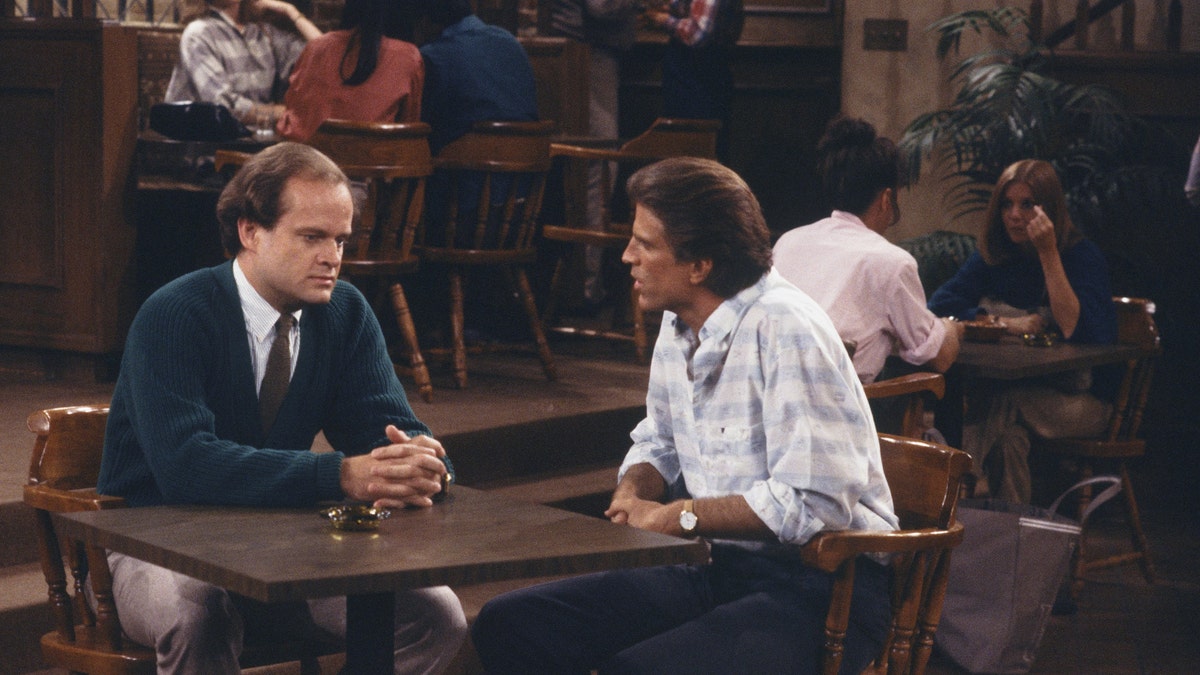 Kelsey Grammer as Dr. Frasier Crane and Ted Danson as Sam Malone in "Cheers." (Photo by: NBCU Photo Bank via Getty)