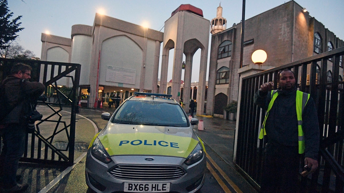 Police outside London Central Mosque in Regent's Park, where police have arrested a man on suspicion of attempted murder, in London, Thursday, Feb. 20, 2020.  (Victoria Jones/PA via AP)