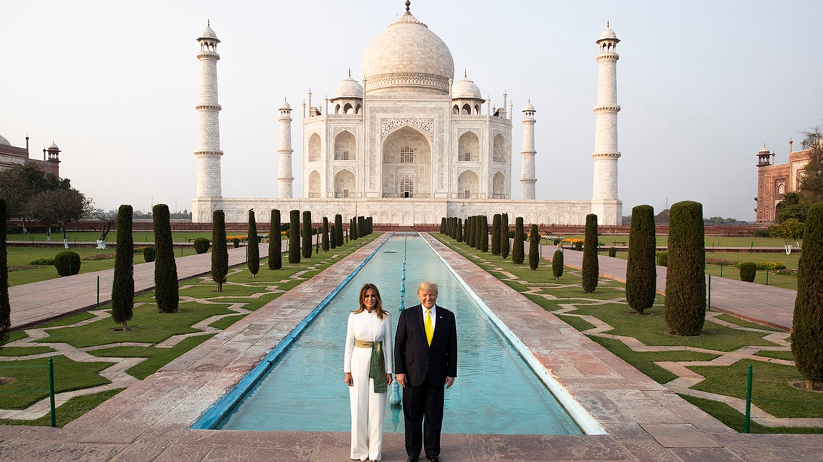 President Donald Trump, with first lady Melania Trump, pause as they tour the Taj Mahal, Monday, Feb. 24, 2020, in Agra, India. (AP Photo/Alex Brandon)