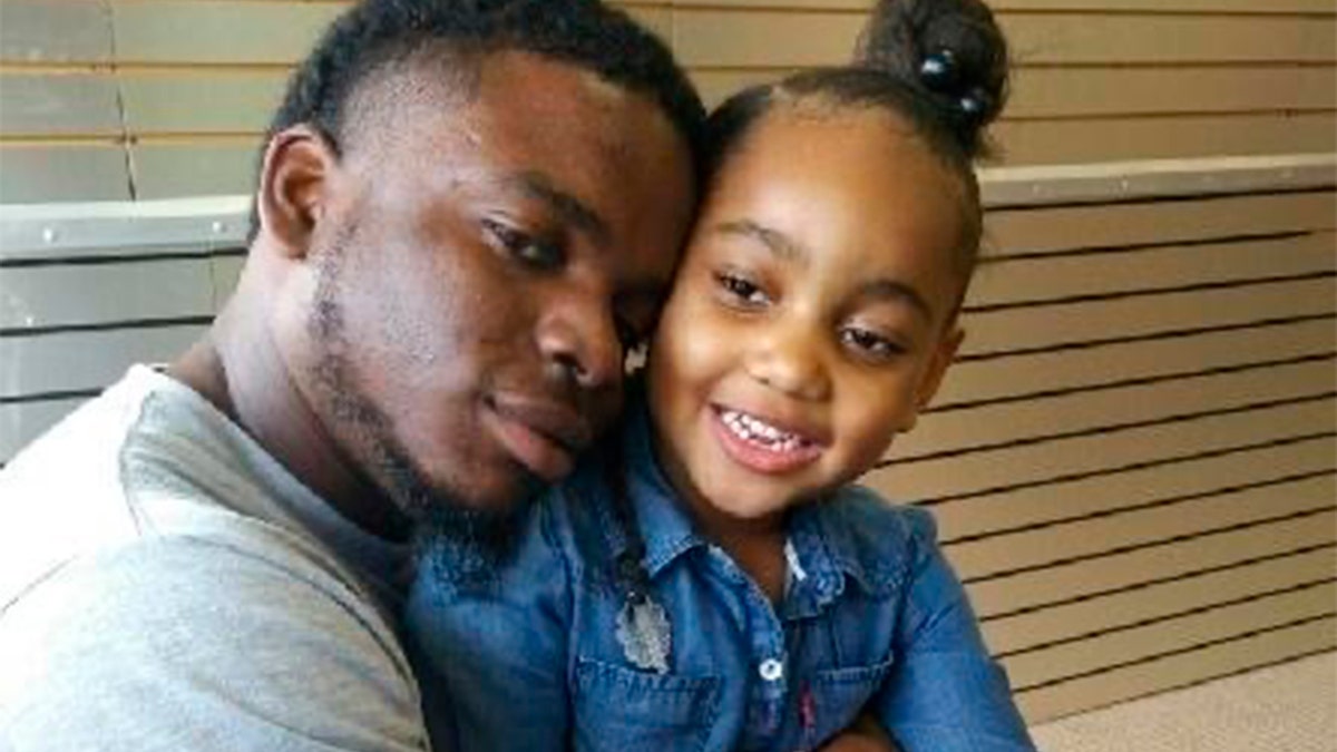 This file photo provided by the family of Michael Dean shows Dean with his daughter Te'yana. (Courtesy from Michael Dean Family via AP, File)