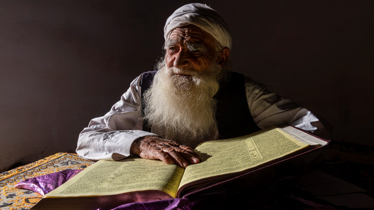 A Sufi cleric reads from the Qur'an in Herat, Afghanistan.