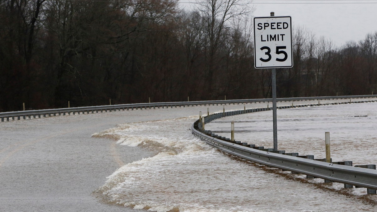 Strong currents from the swollen Pearl River flood over the Old Brandon Road Bridge in Jackson, Miss., Sunday, Feb. 16, 2020.