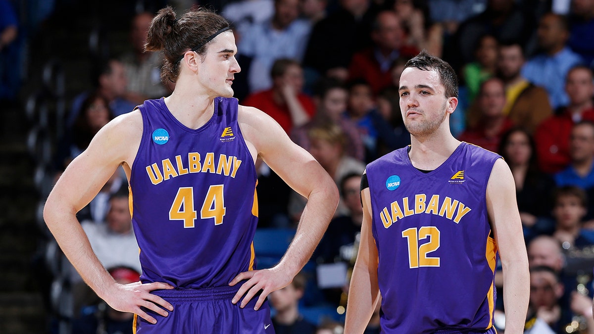 Peter Hooley, right, won a pair of conference tournament MVPs during his time at Albany. (Photo by Joe Robbins/Getty Images)