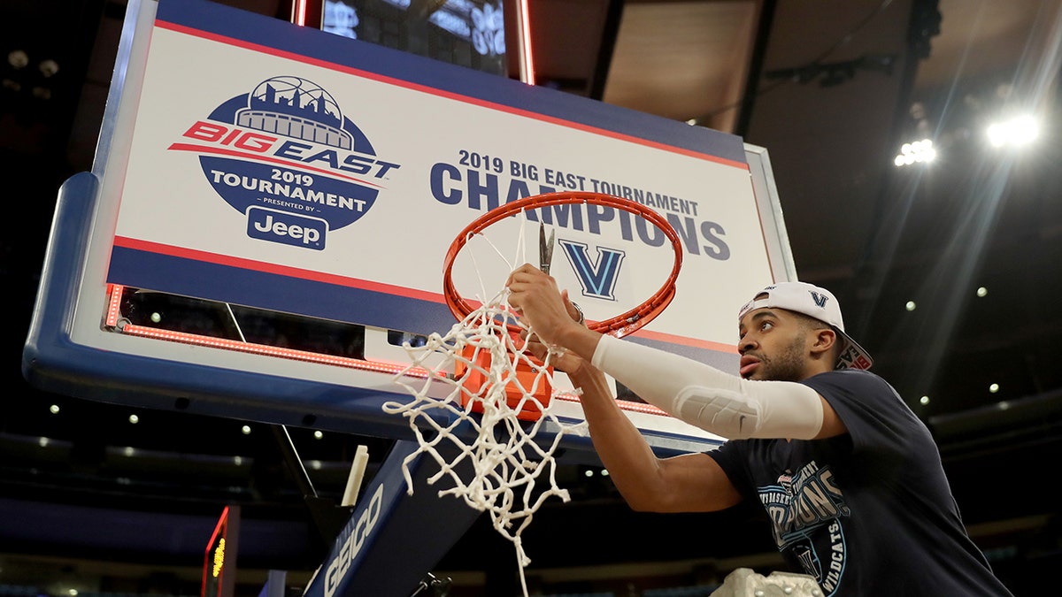 Phil Booth #5 of the Villanova Wildcats cuts down the net after the 74-72 win over the Seton Hall Pirates after the Big East Championship Game at Madison Square Garden on March 16, 2019 in New York City. (Photo by Elsa/Getty Images)