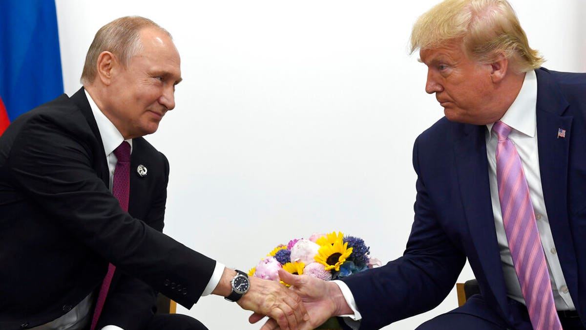 Trump and Putin handshake