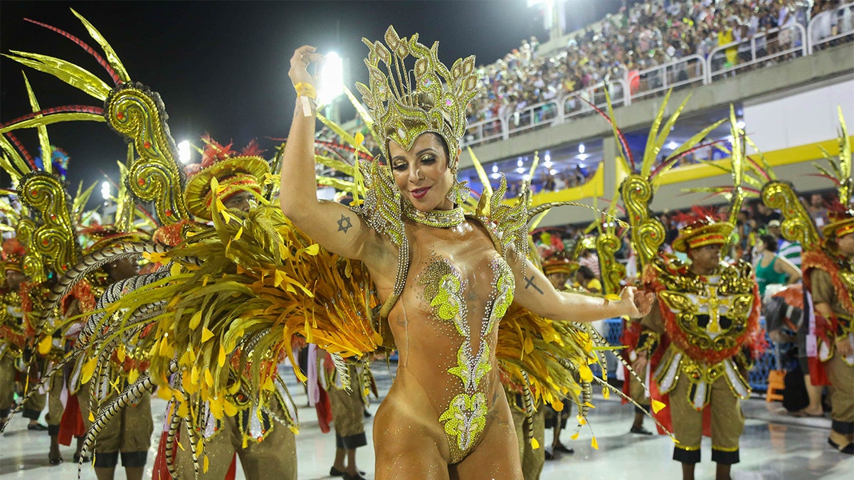 People of the Samba School Academicos de Vigario geral perform during the Rio Carnival, in Rio de Janeiro, Brazil, on February 21, 2020 