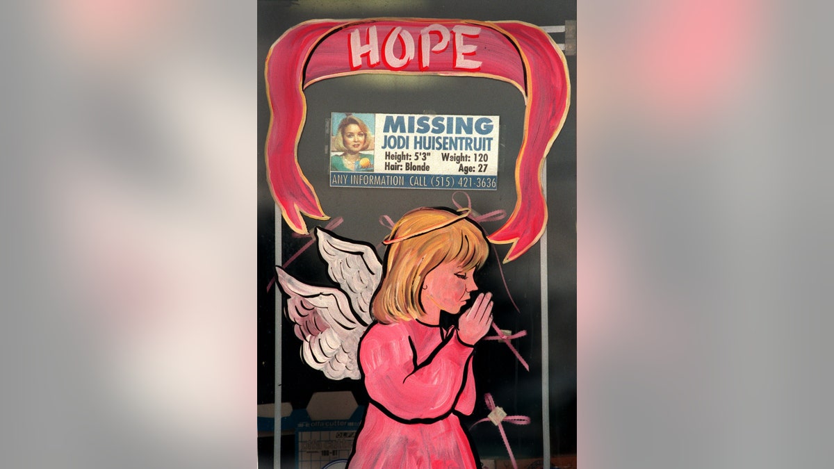 Merchants in Long Prairie decorated their store windows with angels dressed in pink. The message of the season was hope, which many thought of as hope for Jodi Huisentruit, the hometown girl who is still missing. Some merchants incorporated missing posters of Huisentruit into their holiday display. The photo was taken on 1/12/96.