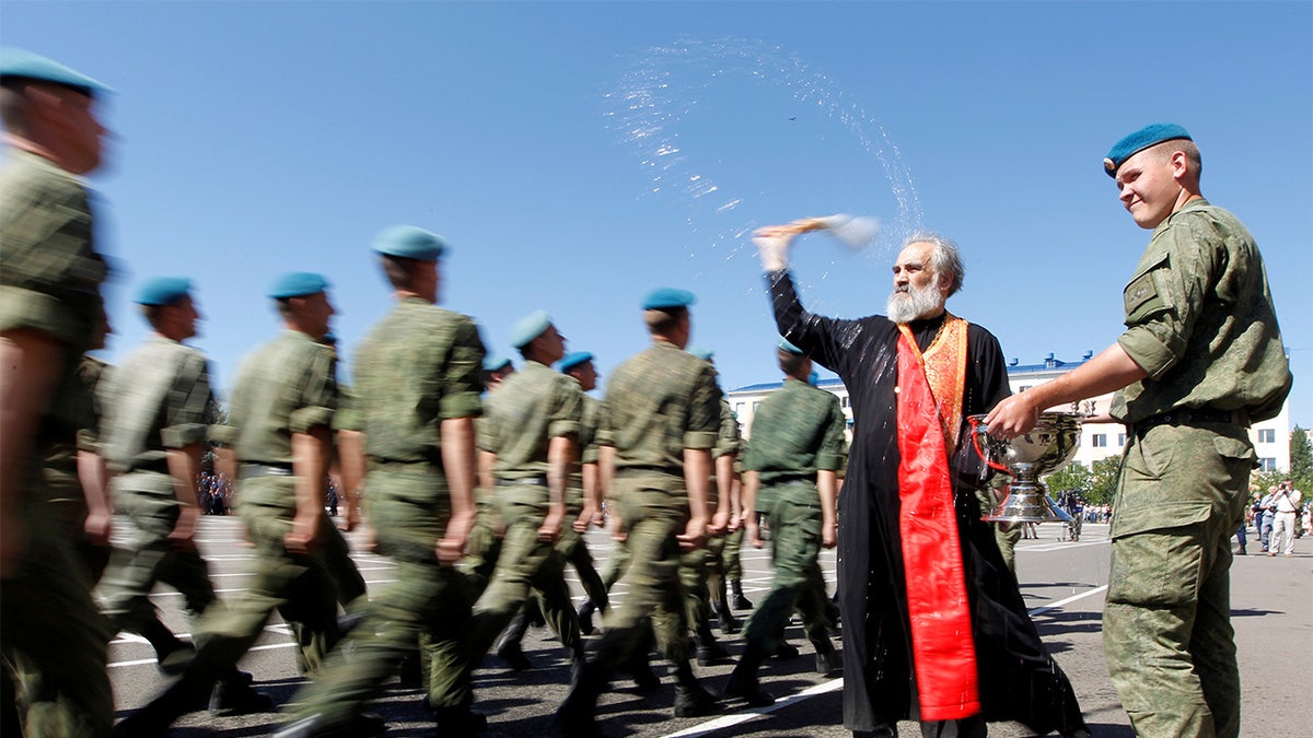 Orthodox priest blessing Russian troops