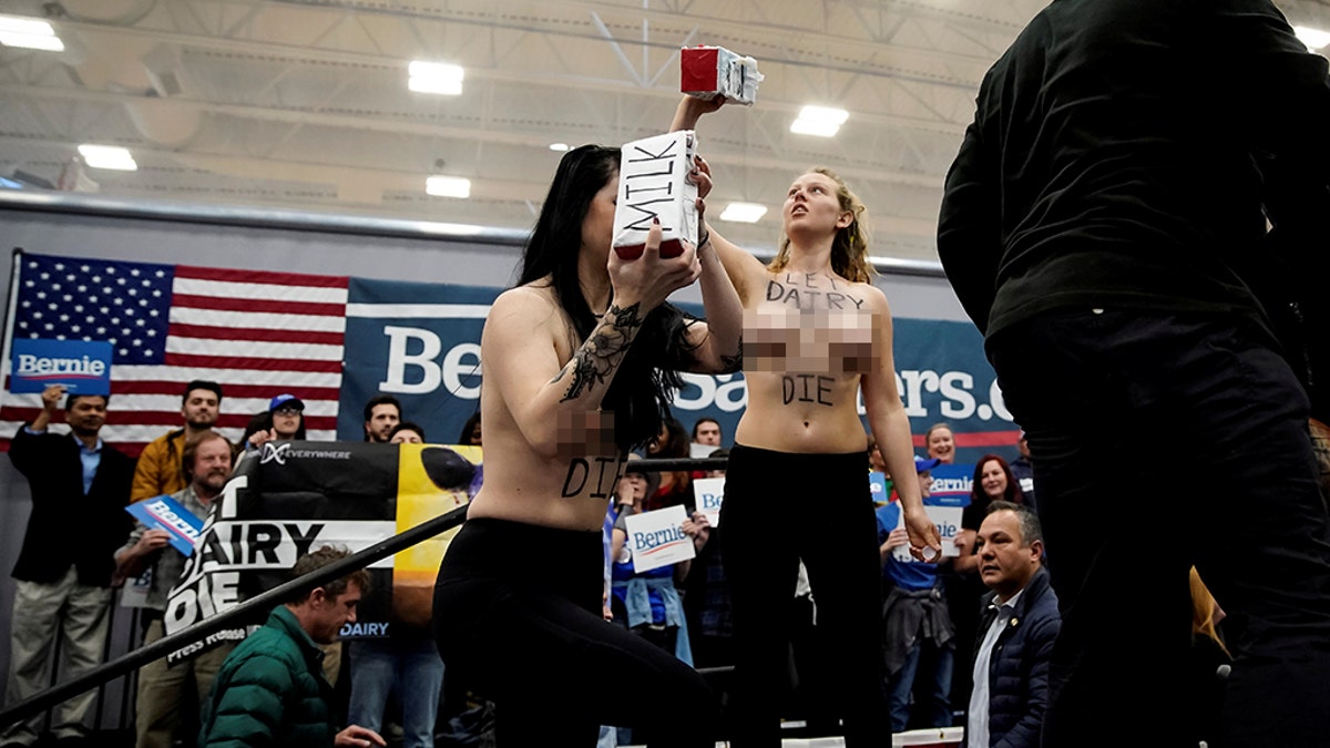At least two topless women took the stage at Sanders' Nevada campaign event.