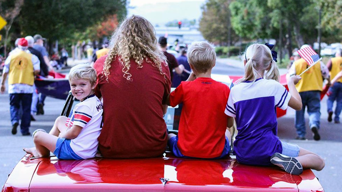 Sean Feucht and his kids at a Veterans Day parade. He released a song with all four of his children called, "Raise Our Voice."