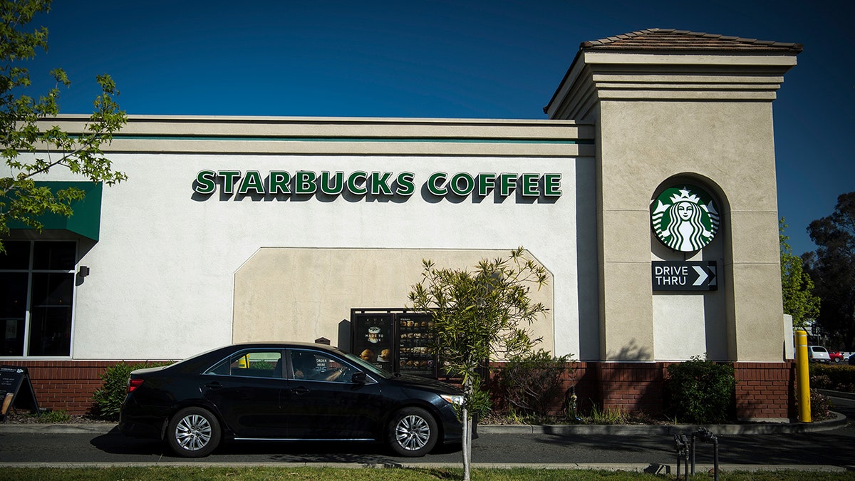 A TikTok video of two customers being surprised by a Starbucks employee greeting them in a song has gone viral – but not for what you’d expect. (Photo: David Paul Morris/Bloomberg via Getty Images