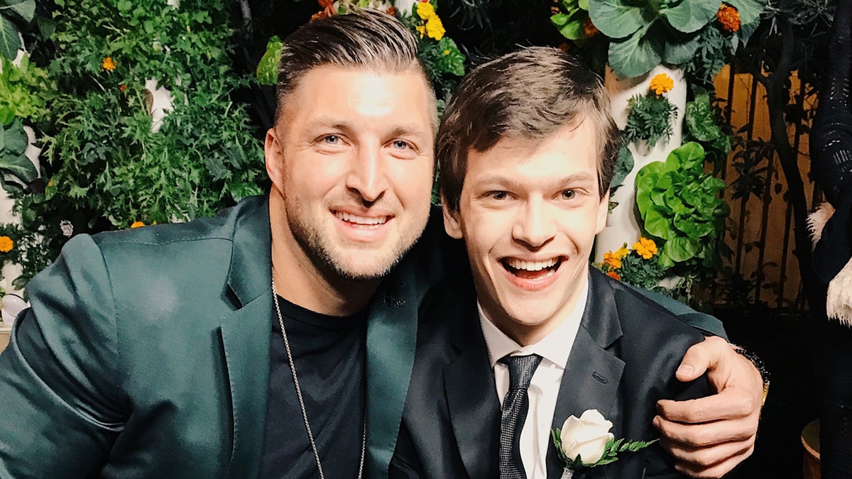 Micah Fowler and Tim Tebow at Zoe Church’s 'Night to Shine' on Feb 8th, 2019.