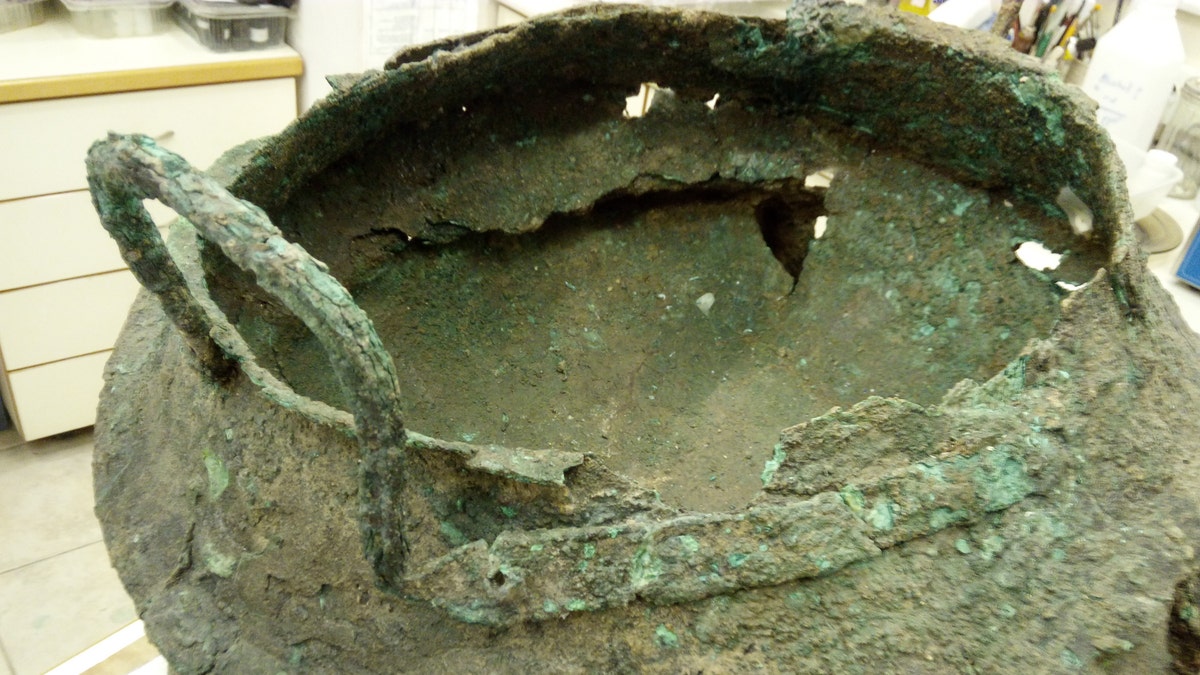 A bronze cauldron discovered at the site. (Credit: T. Rogovski)