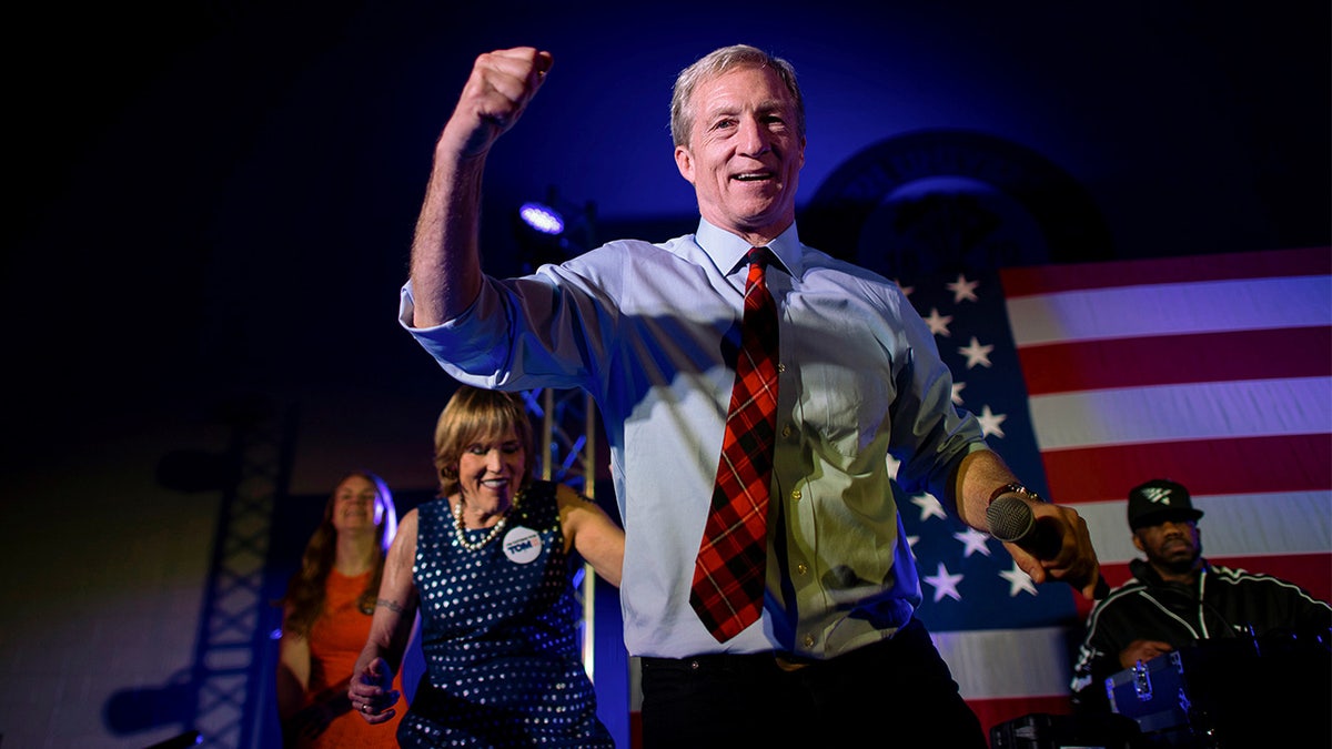 Democratic Presidential candidate entrepreneur Tom Steyer dances onstage with rapper Juvenile singing "Back That Azz Up" during his Get Out the Vote rally in Columbia, South Carolina, U.S., on February 28, 2020.