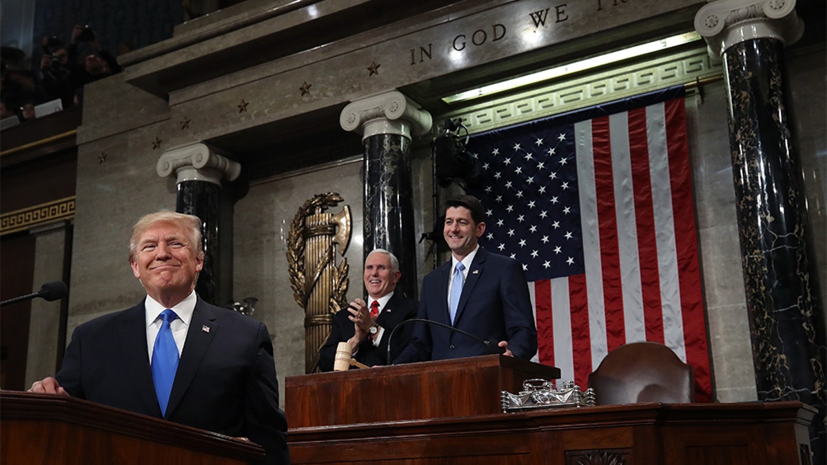 U.S. President Donald J. Trump stands at the podium during his State of the Union address on January 30, 2018.