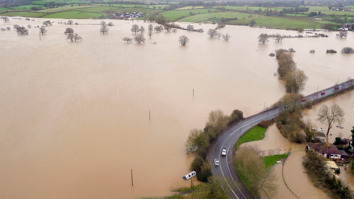 Flood water inundates fields around the town of Upton-upon-Severn, England, after the river Severn burst its banks, in the aftermath of Storm Dennis.