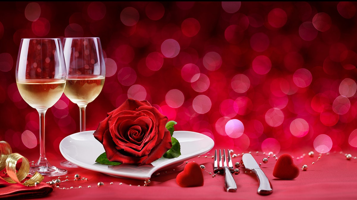 Valentine's Day dinner set up with rose and champagne