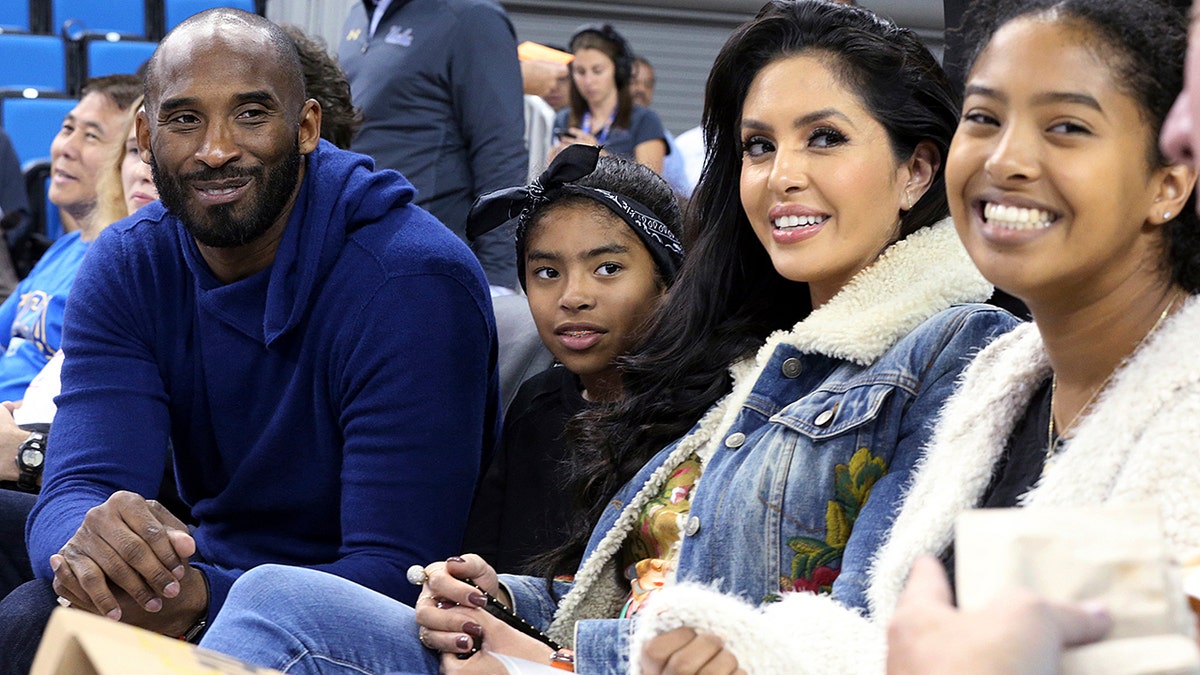 Los Angeles Lakers legend Kobe Bryant, his daughter Gianna Maria-Onore Bryant, wife Vanessa and daughter Natalia Diamante Bryant are seen before a Connecticut-UCLA NCAA women's basketball game in Los Angeles, Nov. 21, 2017. (Associated Press)