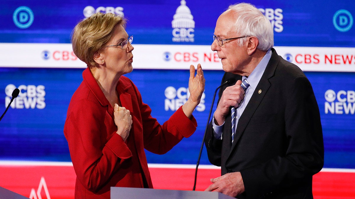 From left, Democratic presidential candidates, Sen. Elizabeth Warren, D-Mass., left, talks with Sen. Bernie Sanders, I-Vt., right, on stage after the Democratic presidential primary debate at the Gaillard Center, Tuesday, Feb. 25, 2020, in Charleston, S.C., co-hosted by CBS News and the Congressional Black Caucus Institute. (AP Photo/Patrick Semansky)