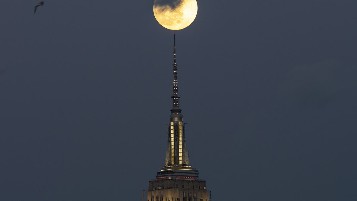 Full Snow Moon rises over the Empire State Building in New York City, United States on February 8, 2020.