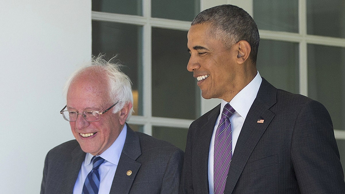 President Barack Obama walks with Democratic presidential candidate Sen. Bernie Sanders, I-Vt., down the Colonnade of the White House in Washington, Thursday, June 9, 2016. (AP Photo/Pablo Martinez Monsivais)