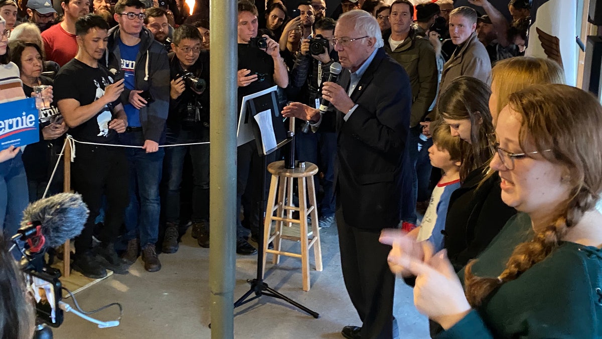 Democratic presidential candidate Sen. Bernie Sanders of Vermont speaks to supporters at a Super Bowl watch party at a sports bar in Des Moines, Iowa on Feb. 2, 2020