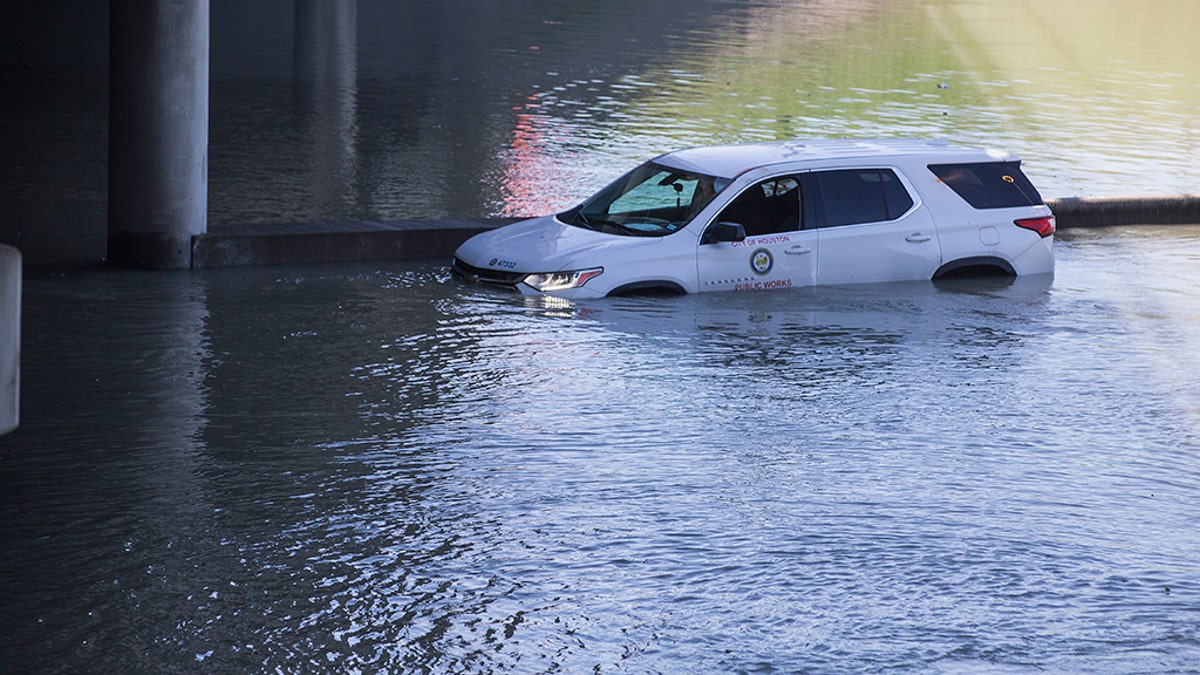 An abandoned vehicle sits stalled in floodwaters from a water main break that inundated the East Loop 610 on Thursday, Feb. 27, 2020 in Houston. (Associated Press)