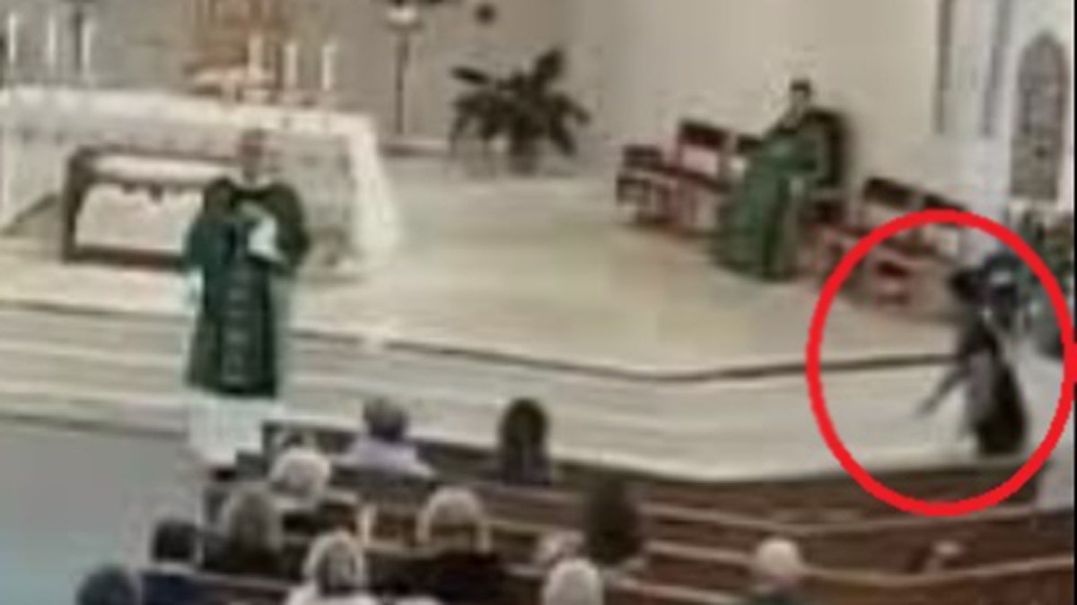 Video shows 28-year-old Thomas Eisel rising from a pew during the homily at St. Coleman Church in Pompano Beach.