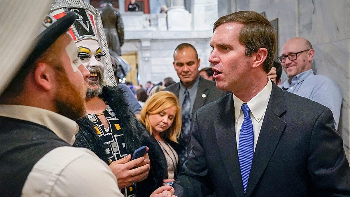 Kentucky Democratic Gov. Andy Beshear greets members of the Kentucky Order of the Sisters of Perpetual Indulgence, an LGBTQ charity group, following an LGBTQ rally at the Capitol building in Frankfort, Ky., Feb. 19, 2020. (Associated Press)