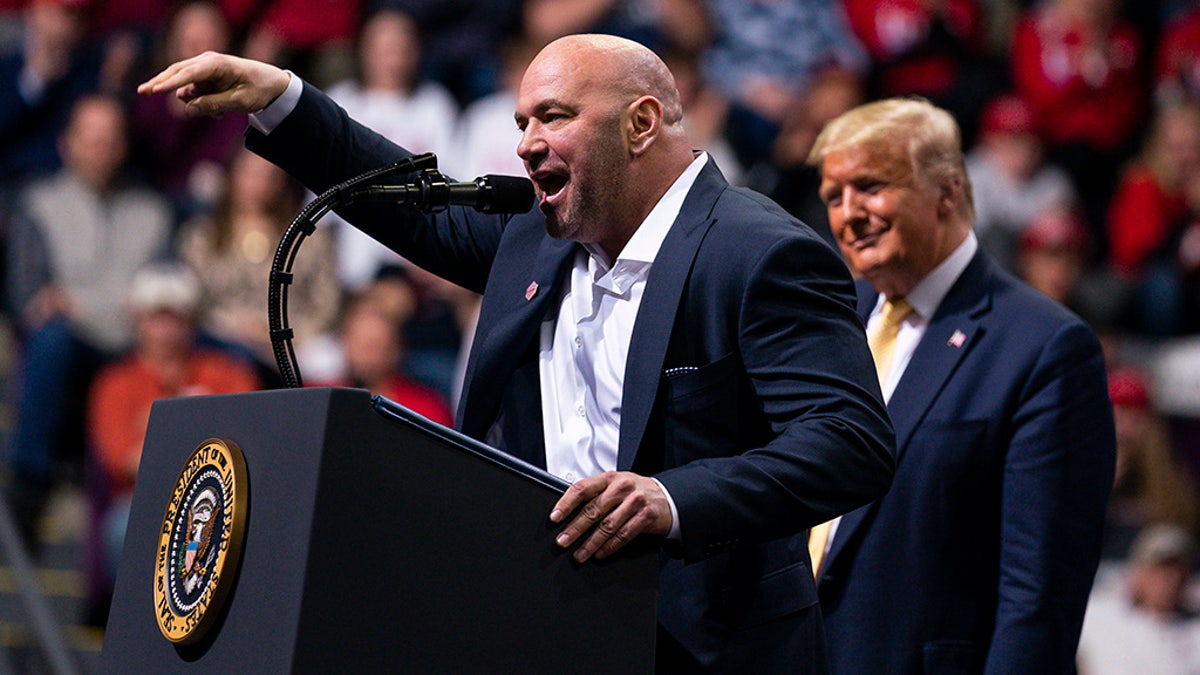 President Donald Trump looks on as Ultimate Fighting Championship President Dana White speaks during a campaign rally at the Broadmoor World Arena,  Feb. 20, in Colorado Springs, Colorado. (AP Photo/Evan Vucci)